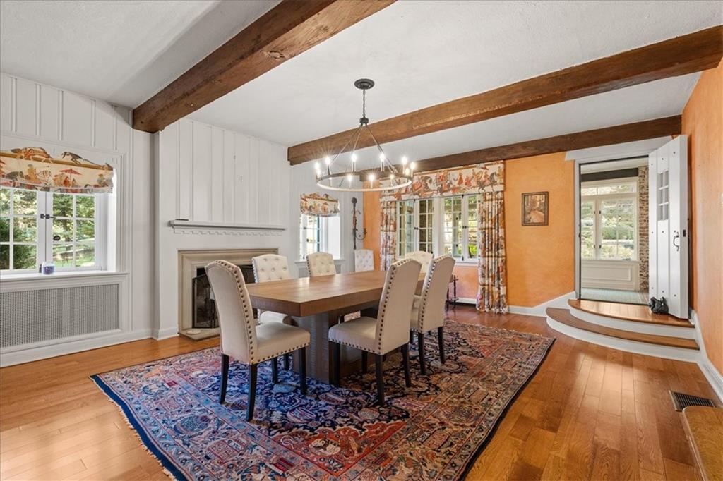 430 Woodland Road Sewickley, PA 15143 - Photo 16 of 49 a view of a dining room with furniture window and wooden floor