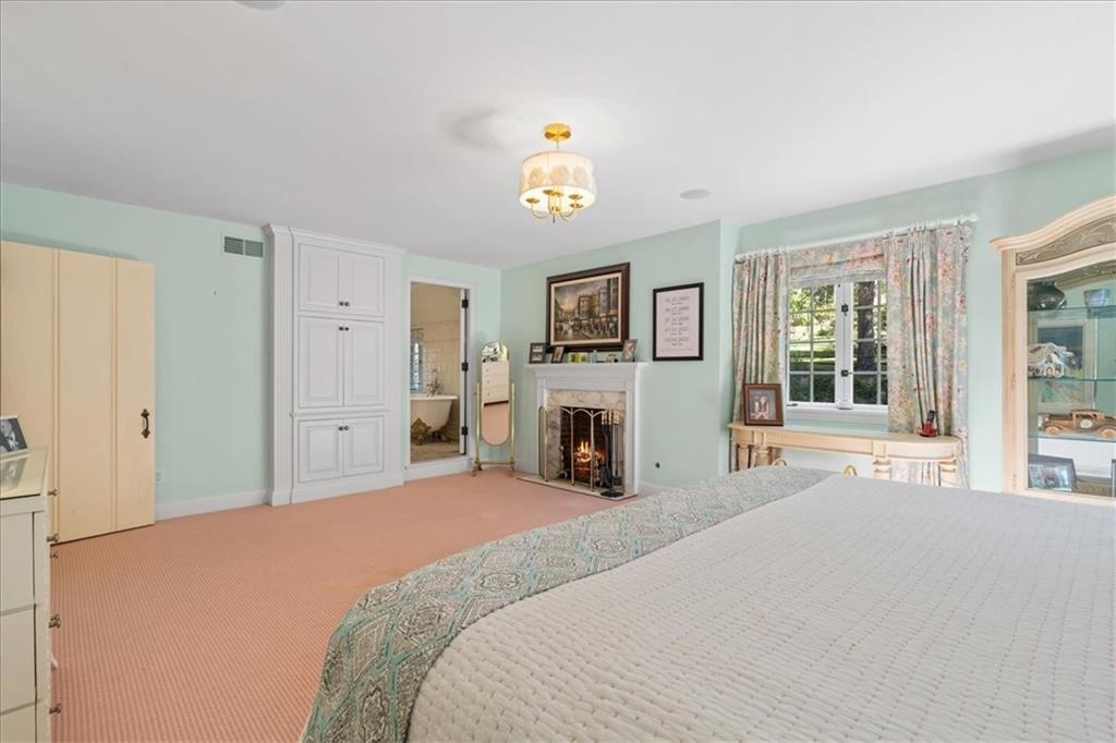 430 Woodland Road Sewickley, PA 15143 - Photo 39 of 49 a bedroom with a bed and a large window