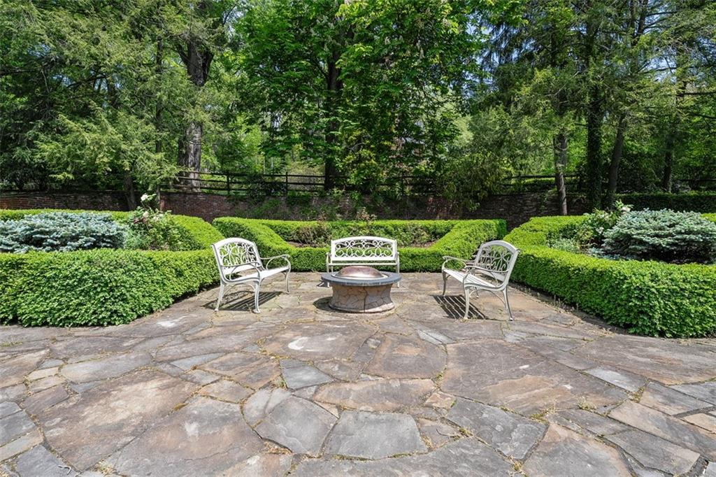 430 Woodland Road Sewickley, PA 15143 - Photo 44 of 49 a view of backyard with table and chairs and potted plants