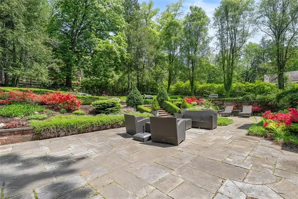 a view of a garden with patio