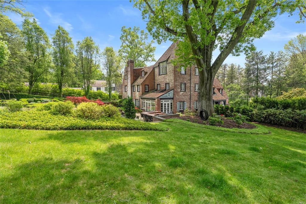 430 Woodland Road Sewickley, PA 15143 - Photo 47 of 49 a garden with trees in front of it