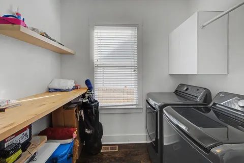 a view of a hallway with workspace and stairs
