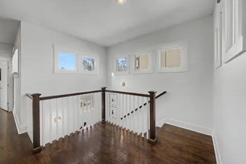 a living room with furniture a flat screen tv and a rug