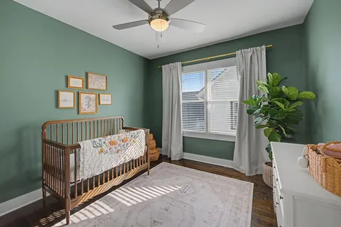 a bedroom with furniture and a chandelier
