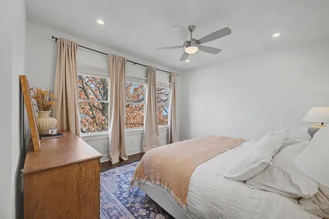 a bedroom with a bed and window