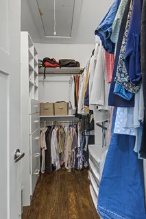 a view of a yard with table and chairs and wooden fence