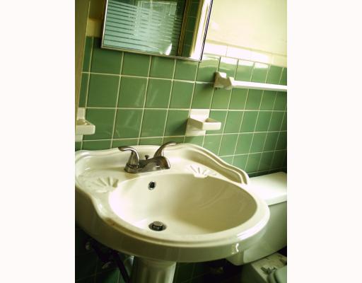 3437 Topeka Street Corpus Christi, TX 78411 - Photo 4 of 5 a bathroom with a sink and a mirror