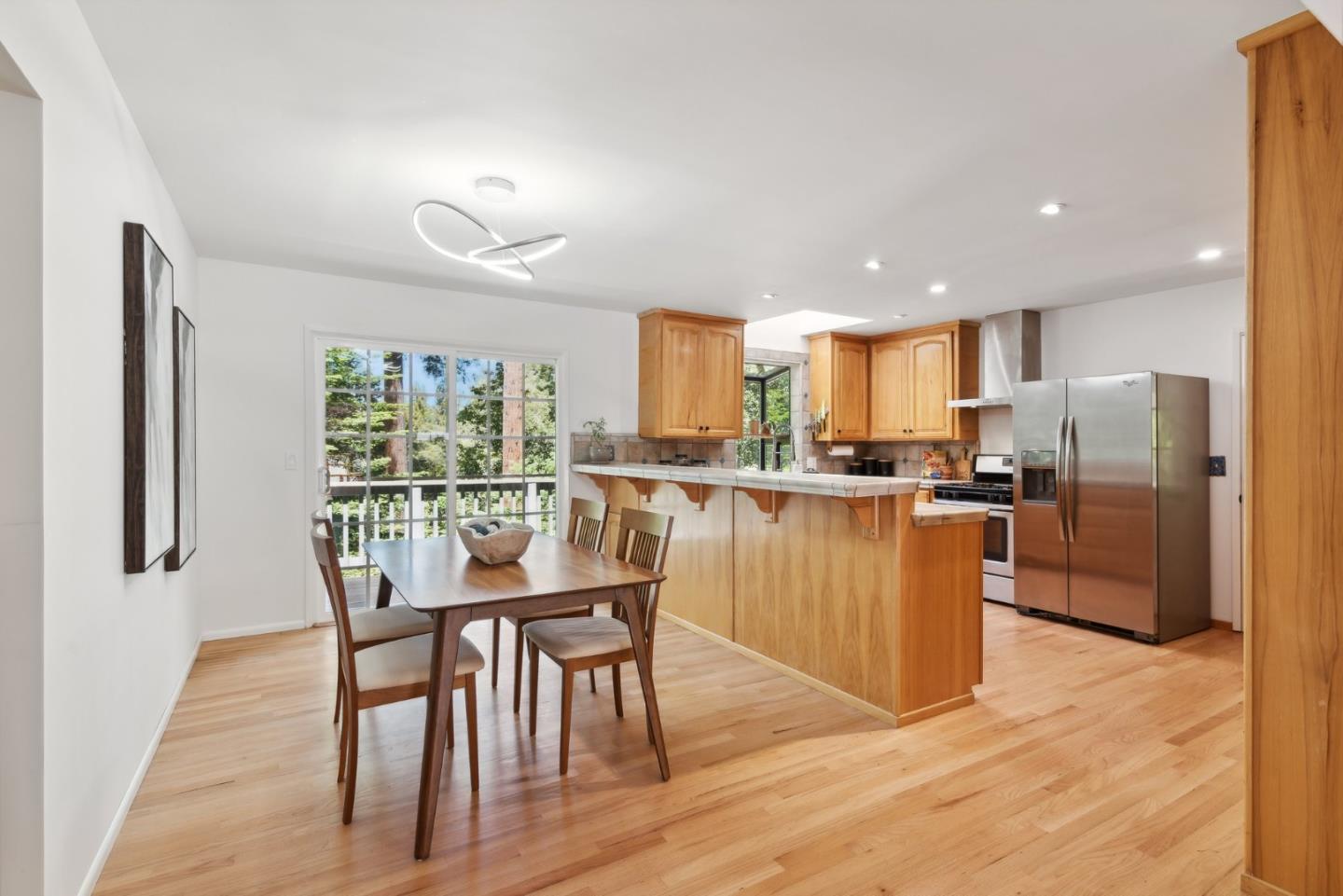 141 William Way Felton, CA 95018 - Photo 12 of 54 a kitchen with stainless steel appliances granite countertop a refrigerator a kitchen island a stove a table and chairs