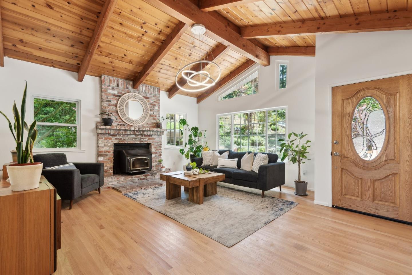 141 William Way Felton, CA 95018 - Photo 7 of 54 a living room with furniture a fireplace a clock and a large window