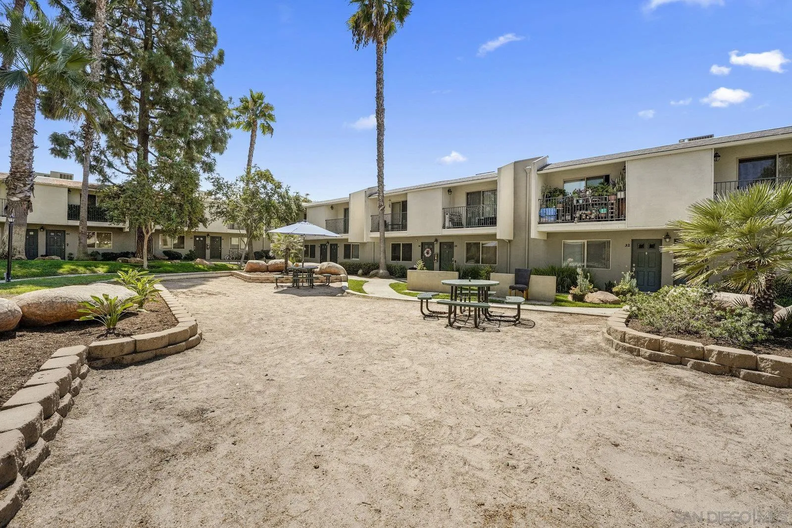 1045 Peach Avenue, Unit 59 El Cajon, CA 92021 - Photo 19 of 19 a view of a patio with table and chairs and potted plants