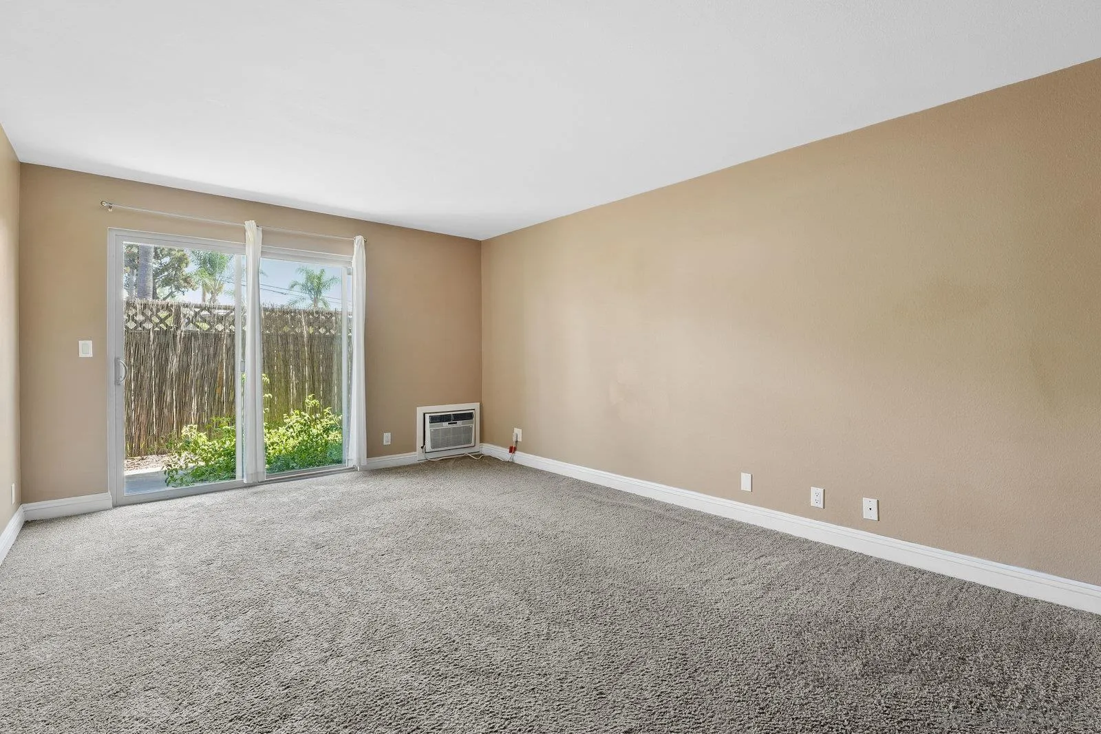 1045 Peach Avenue, Unit 59 El Cajon, CA 92021 - Photo 2 of 19 a view of an empty room with windows
