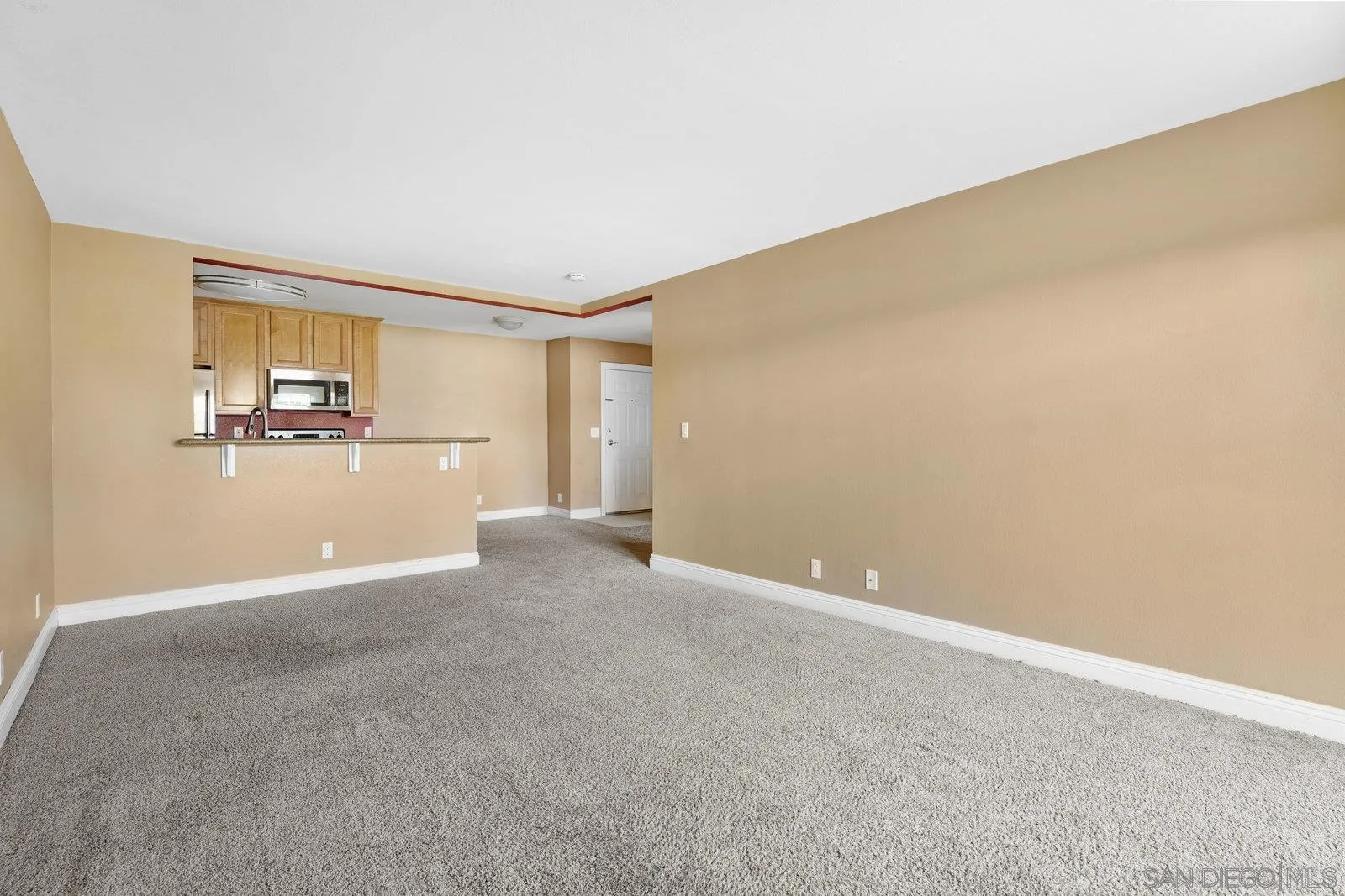 1045 Peach Avenue, Unit 59 El Cajon, CA 92021 - Photo 4 of 19 a view of a big room with wooden floor and windows