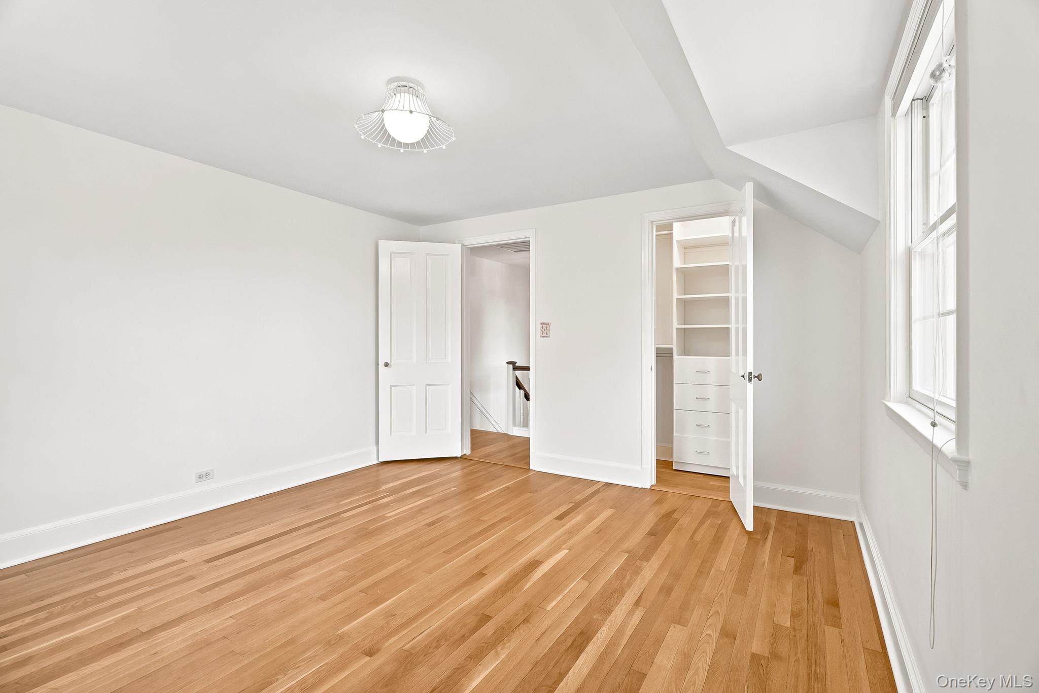 1 Sheridan Road Scarsdale, NY 10583 - Photo 30 of 40 Spacious second floor bedroom showing fitted closet and access from hall