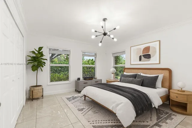 a bedroom with a large bed and a window