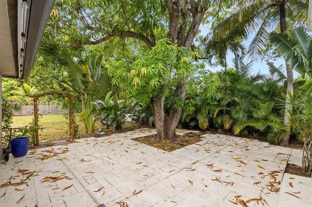 a view of a backyard of the house