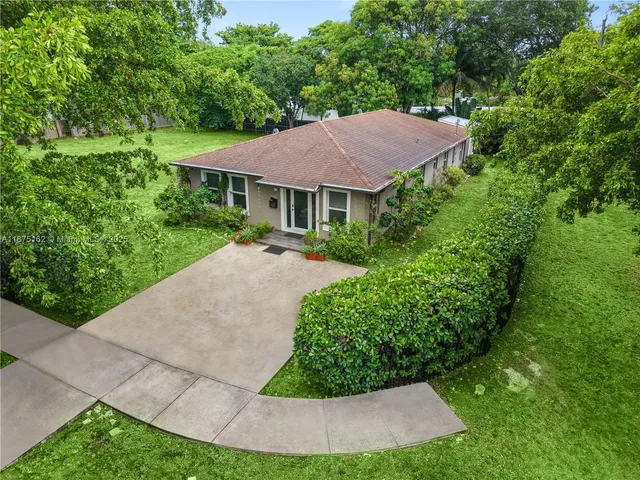front view of a house with a potted plant