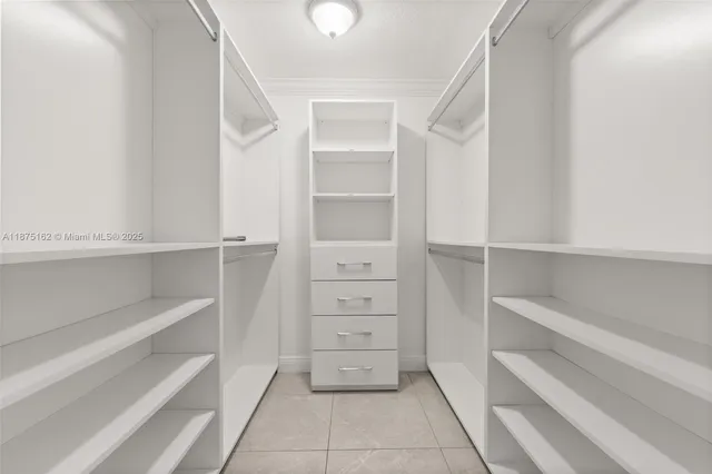 a view of an empty walk in closet