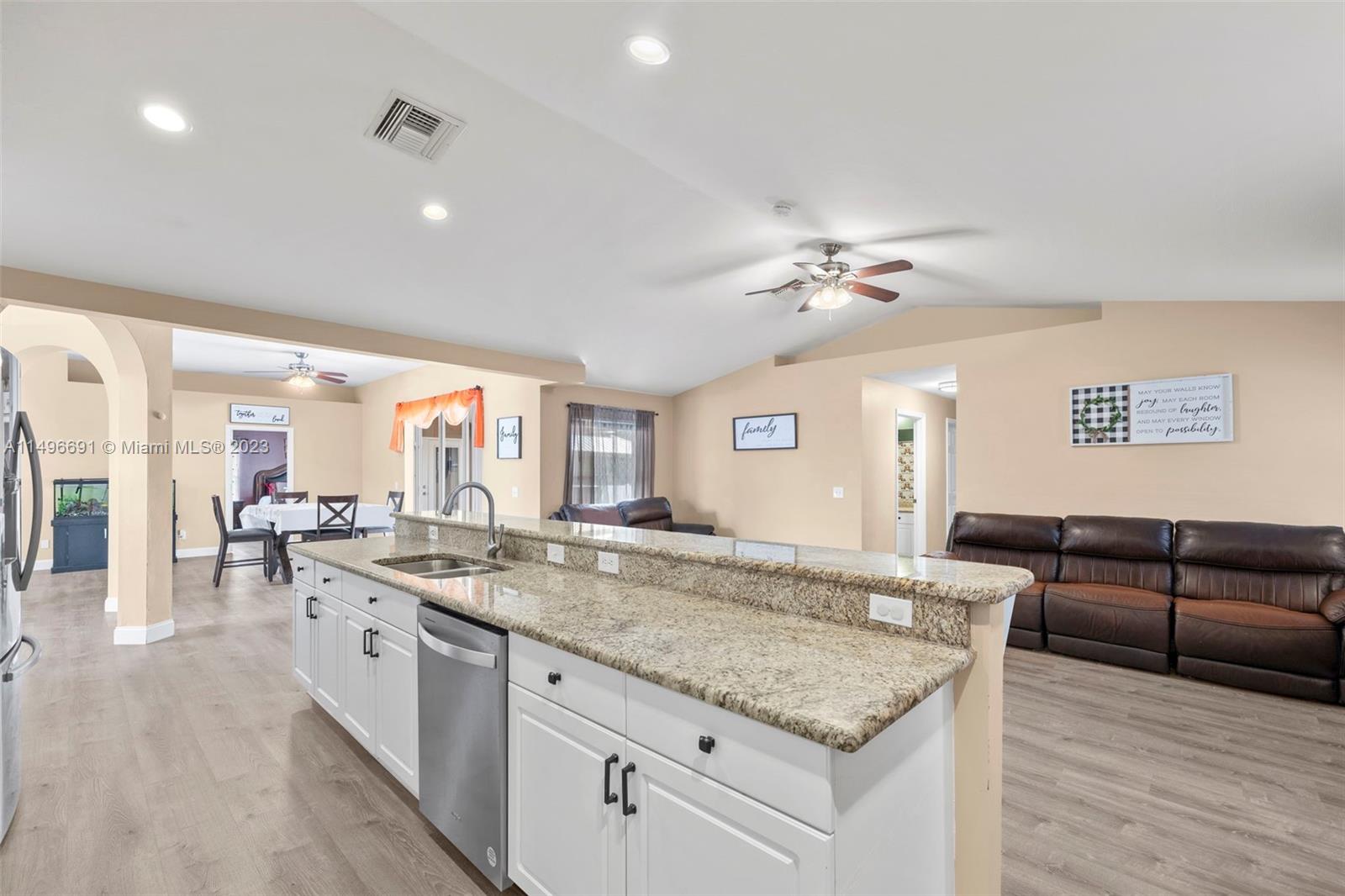 775 Arundel Circle Fort Myers, FL 33913 - Photo 13 of 26 a view of living room with granite countertop furniture and fireplace