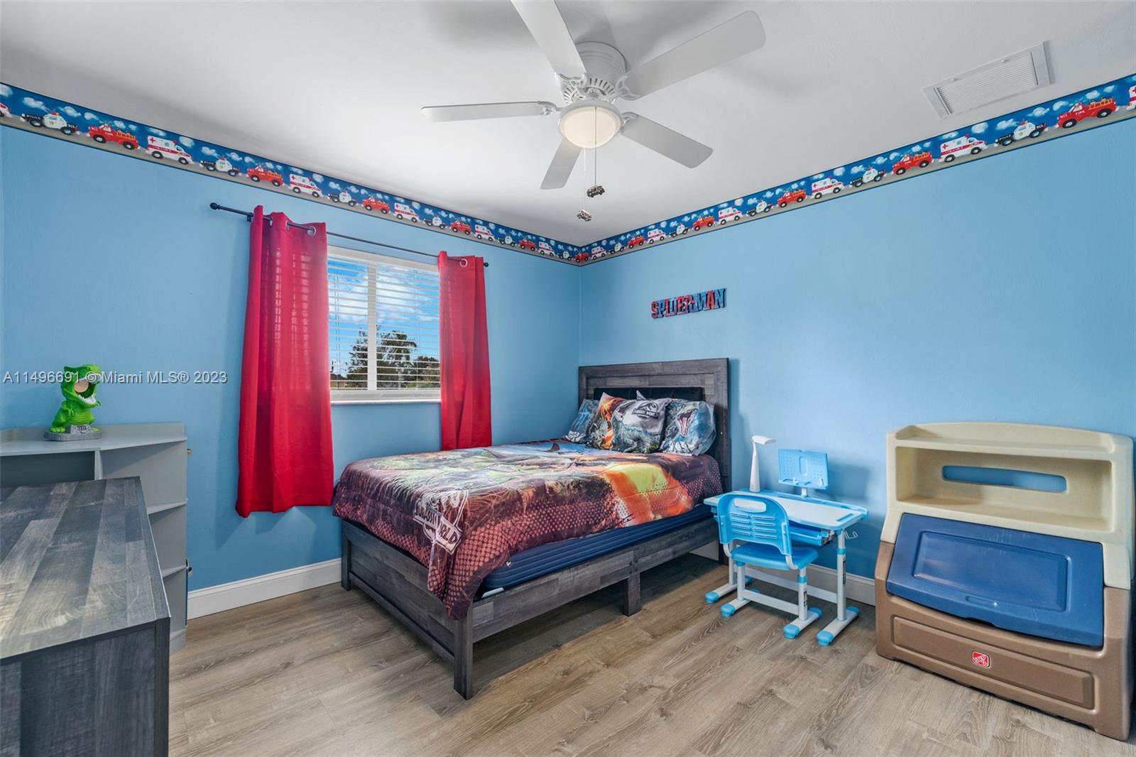 775 Arundel Circle Fort Myers, FL 33913 - Photo 21 of 26 a bedroom with a bed and a chandelier