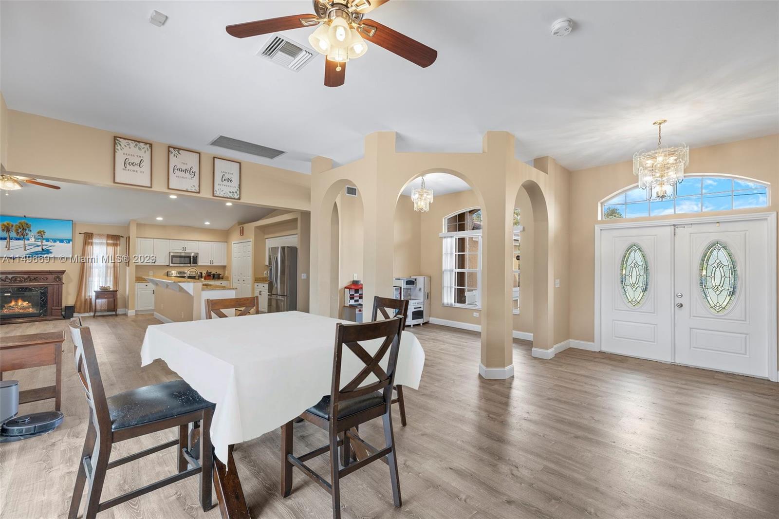 775 Arundel Circle Fort Myers, FL 33913 - Photo 3 of 26 a view of a dining room with furniture and wooden floor