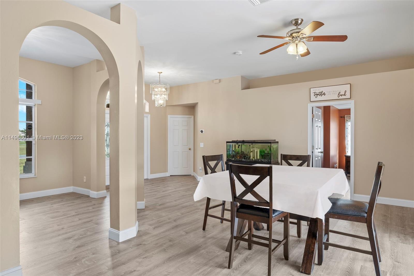 775 Arundel Circle Fort Myers, FL 33913 - Photo 4 of 26 a view of a dining room with furniture and wooden floor