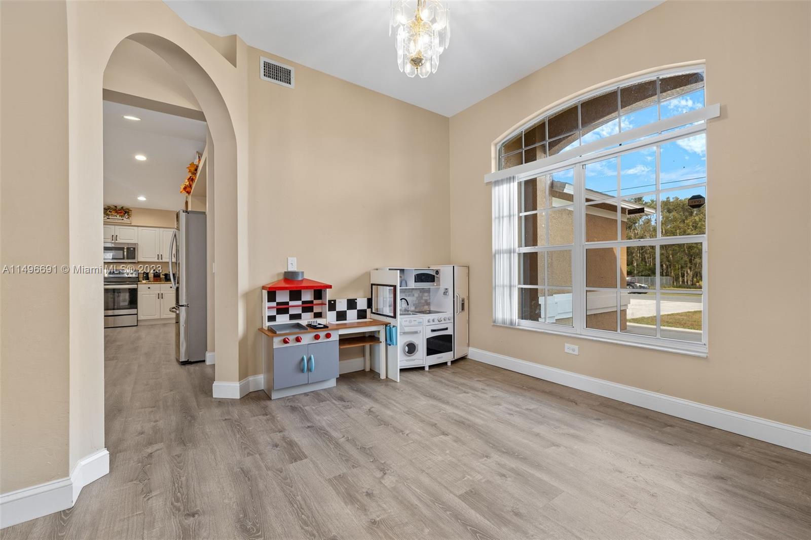 775 Arundel Circle Fort Myers, FL 33913 - Photo 5 of 26 a view of a livingroom with workspace and a window