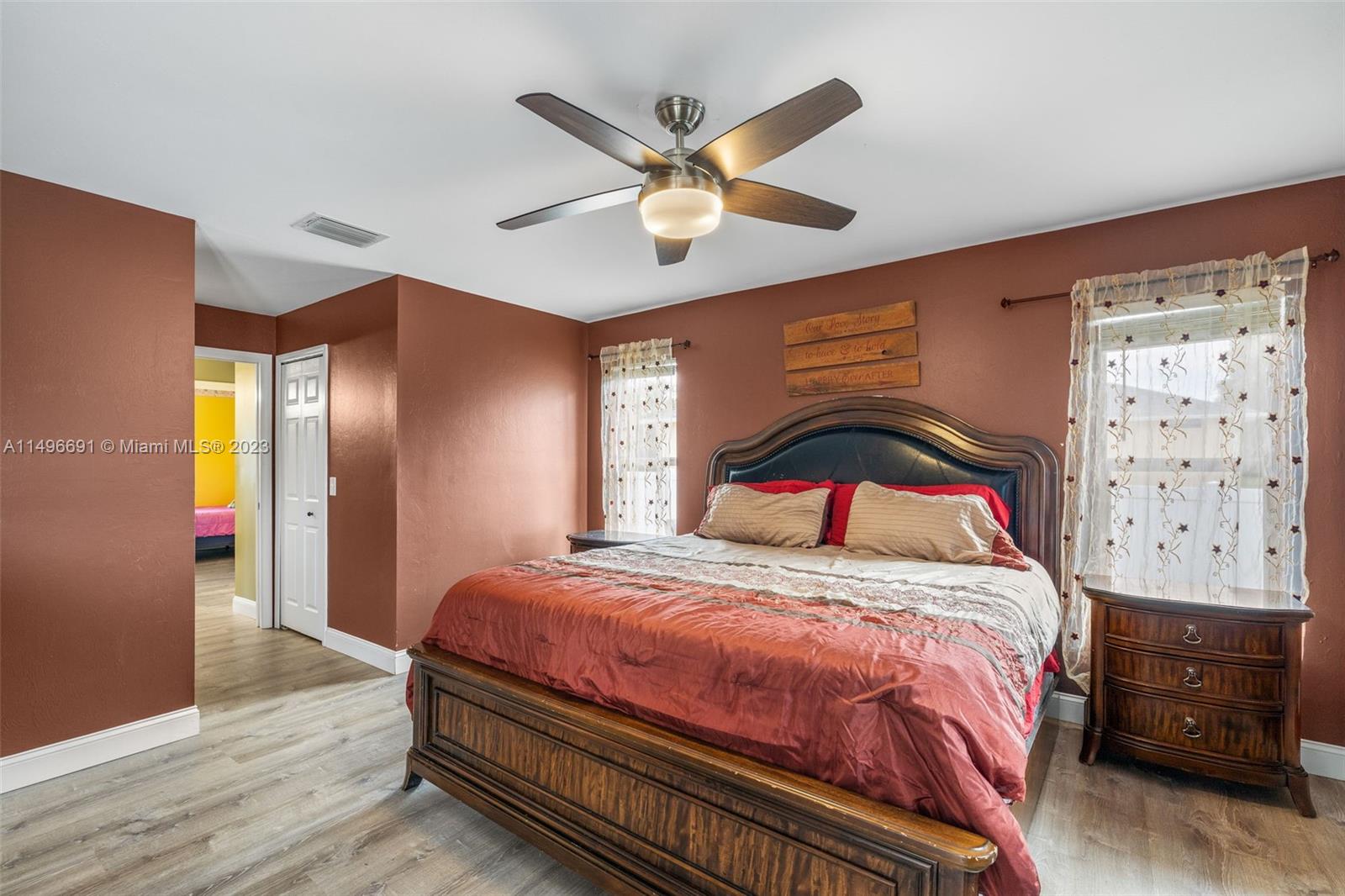 775 Arundel Circle Fort Myers, FL 33913 - Photo 8 of 26 a bedroom with a bed and a chandelier
