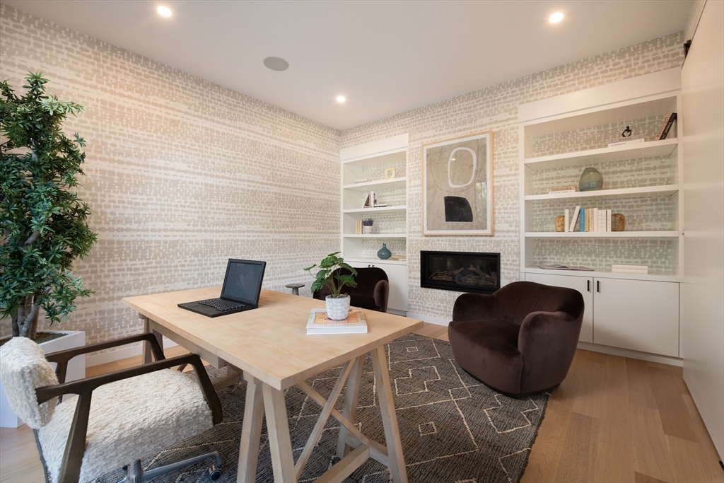 39 Westfield Road Newton, MA 02465 - Photo 22 of 42 a living room with furniture a fireplace and a potted plant