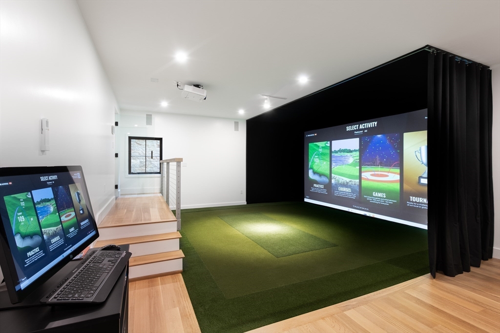 39 Westfield Road Newton, MA 02465 - Photo 38 of 42 a living room with a flat screen tv and a fireplace
