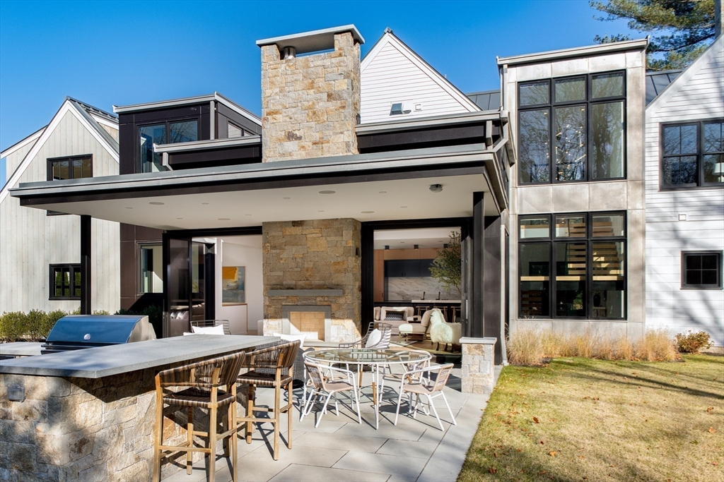 39 Westfield Road Newton, MA 02465 - Photo 9 of 42 a view of a dinning table and chairs in the patio