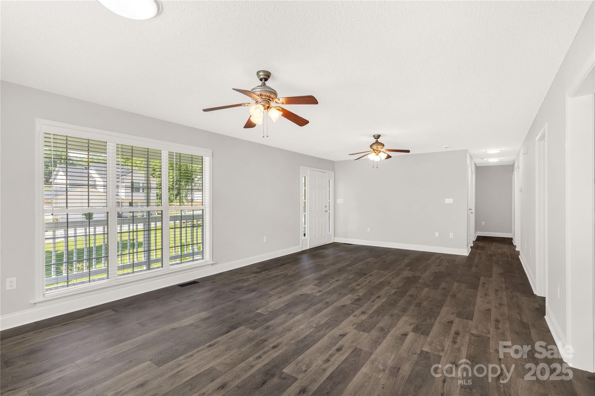 1675 Old Lynwood Circle Lancaster, SC 29720 - Photo 11 of 32 wooden floor in an empty room with a window