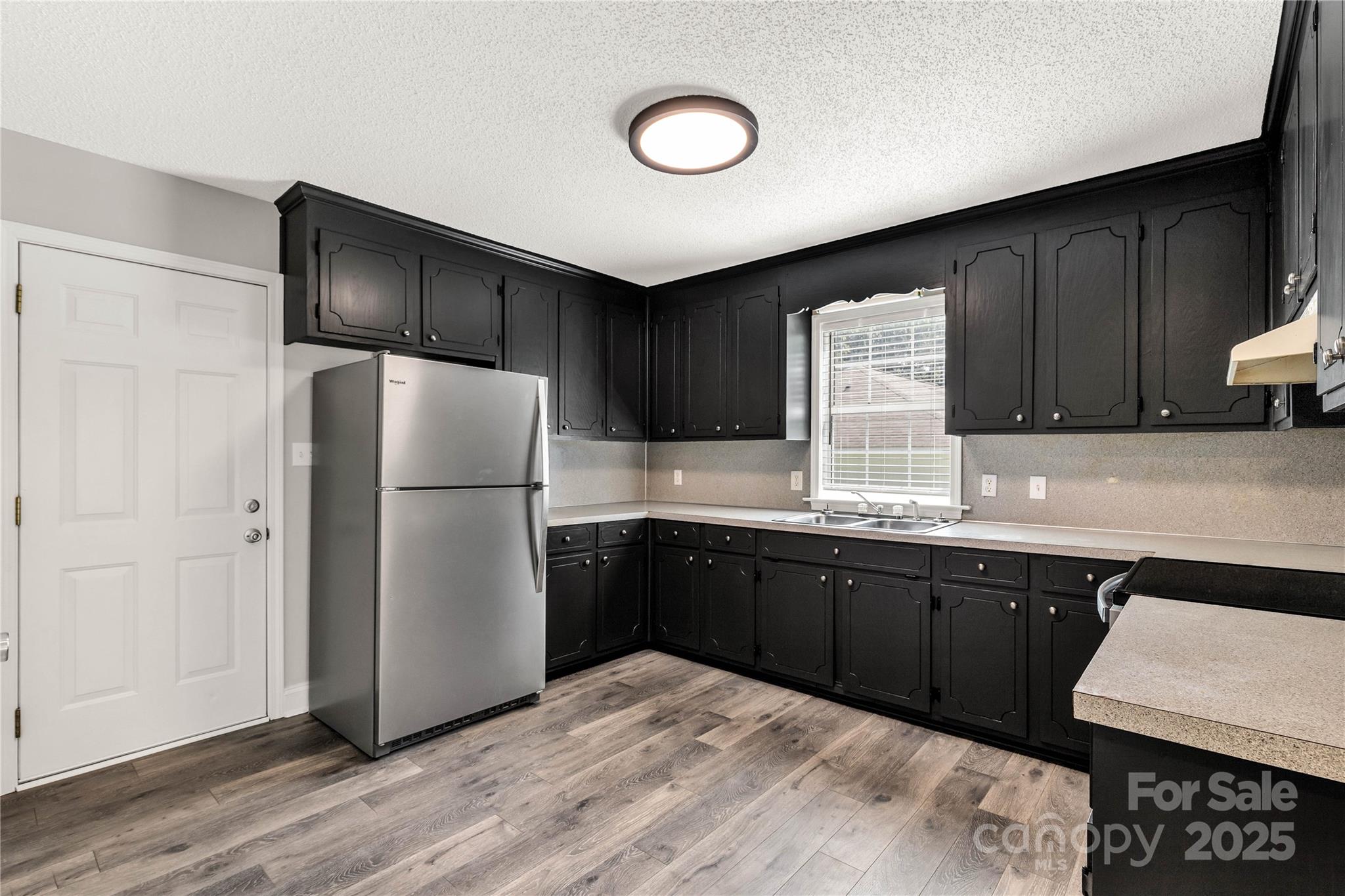 1675 Old Lynwood Circle Lancaster, SC 29720 - Photo 12 of 32 a kitchen with stainless steel appliances granite countertop a refrigerator and a sink