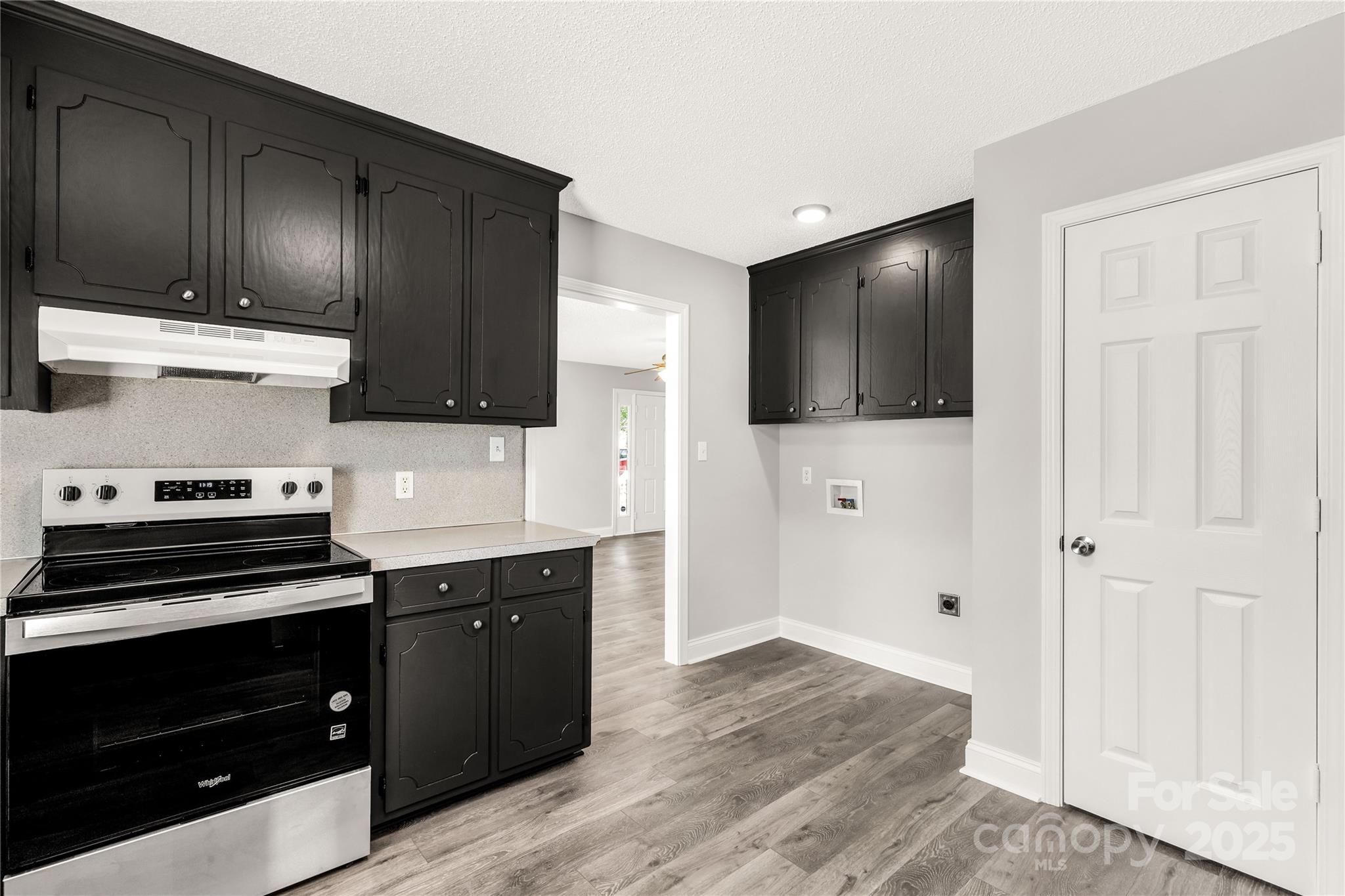 1675 Old Lynwood Circle Lancaster, SC 29720 - Photo 14 of 32 a kitchen with stainless steel appliances wooden cabinets and stove