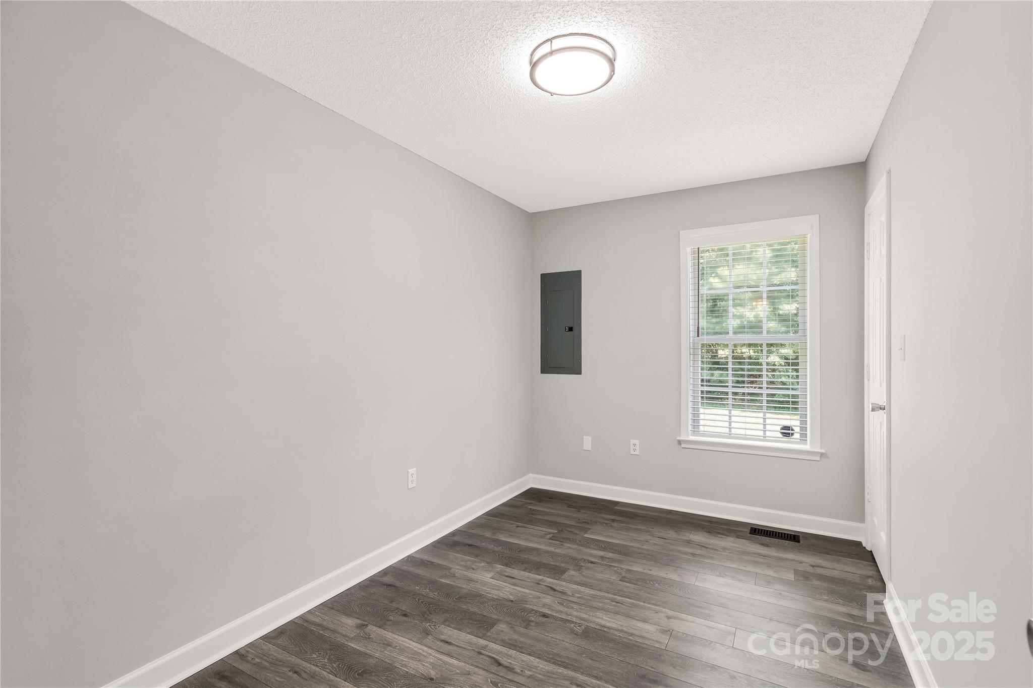 1675 Old Lynwood Circle Lancaster, SC 29720 - Photo 15 of 32 an empty room with wooden floor and windows