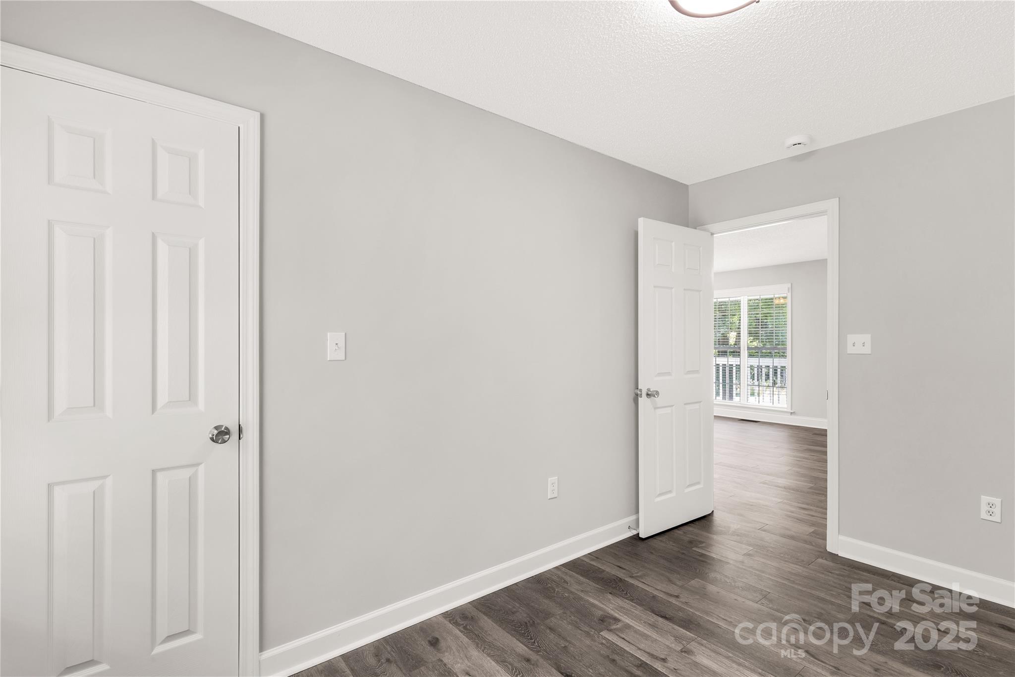 1675 Old Lynwood Circle Lancaster, SC 29720 - Photo 16 of 32 an empty room with wooden floor and windows