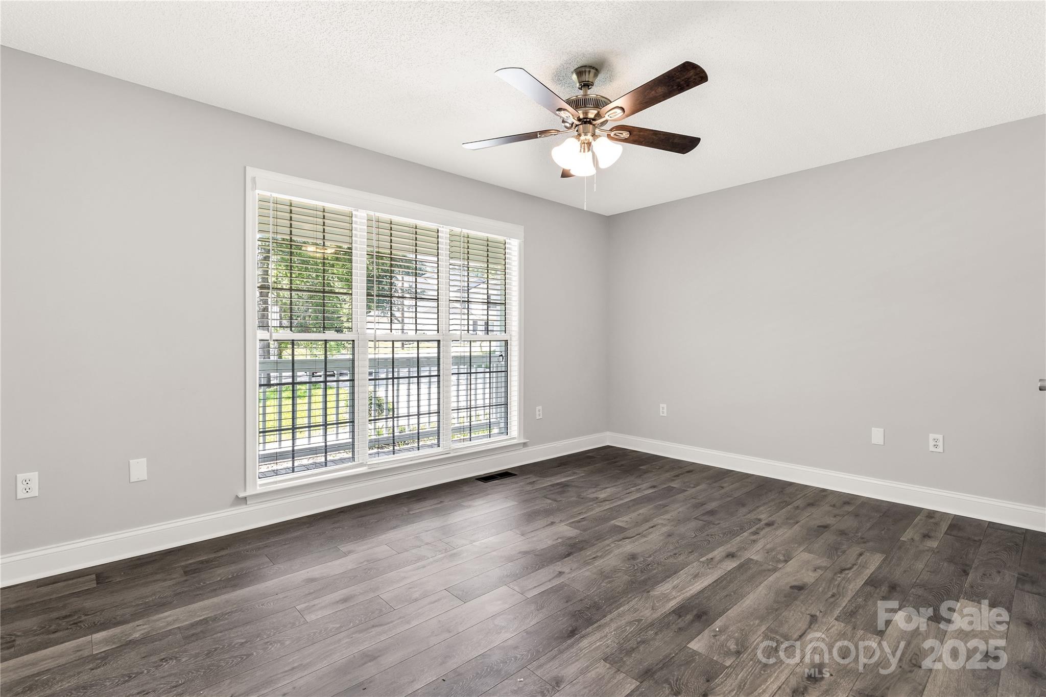 1675 Old Lynwood Circle Lancaster, SC 29720 - Photo 20 of 32 a view of an empty room with wooden floor and a window