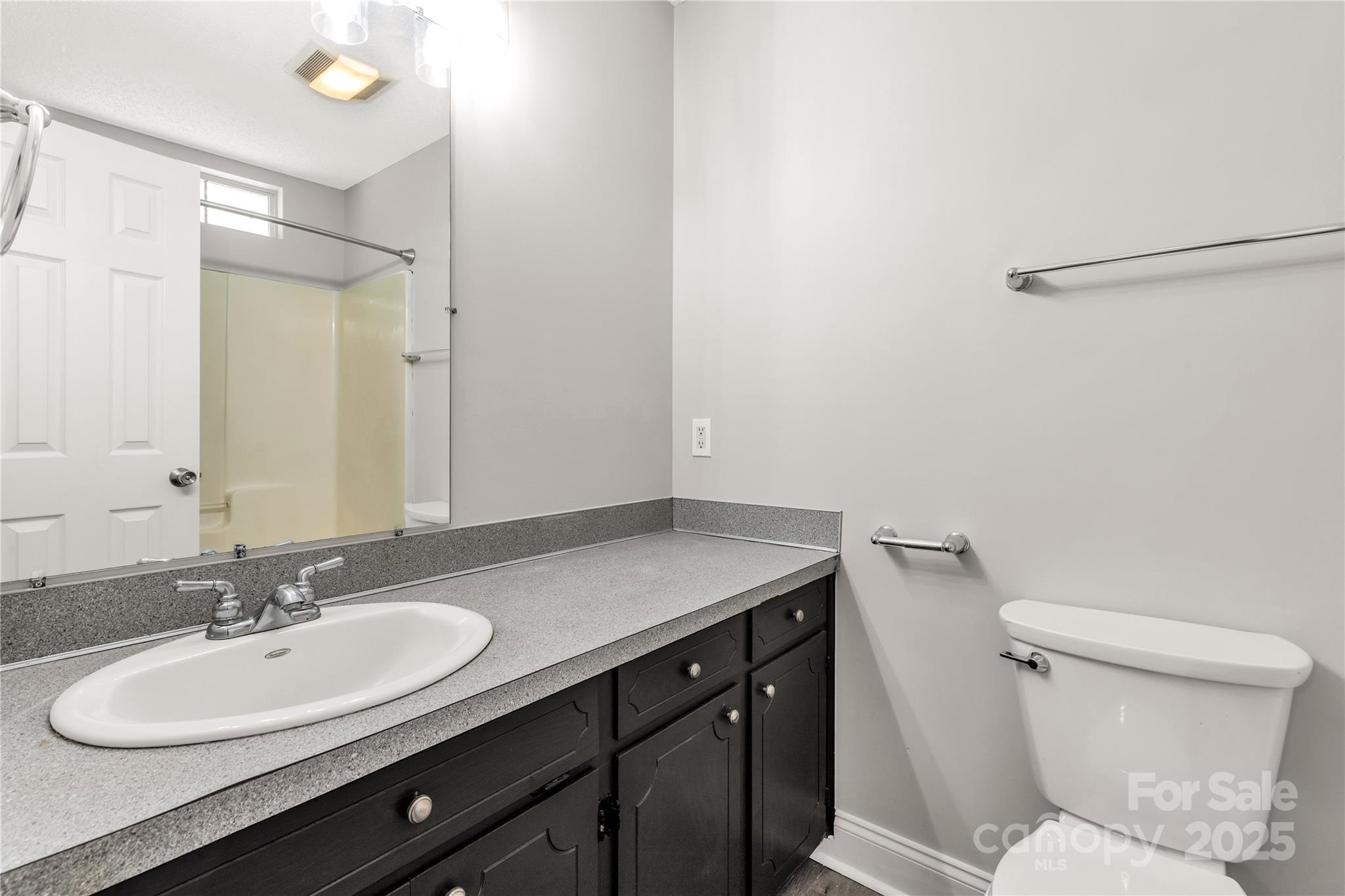 1675 Old Lynwood Circle Lancaster, SC 29720 - Photo 22 of 32 a bathroom with a sink toilet vanity and a mirror