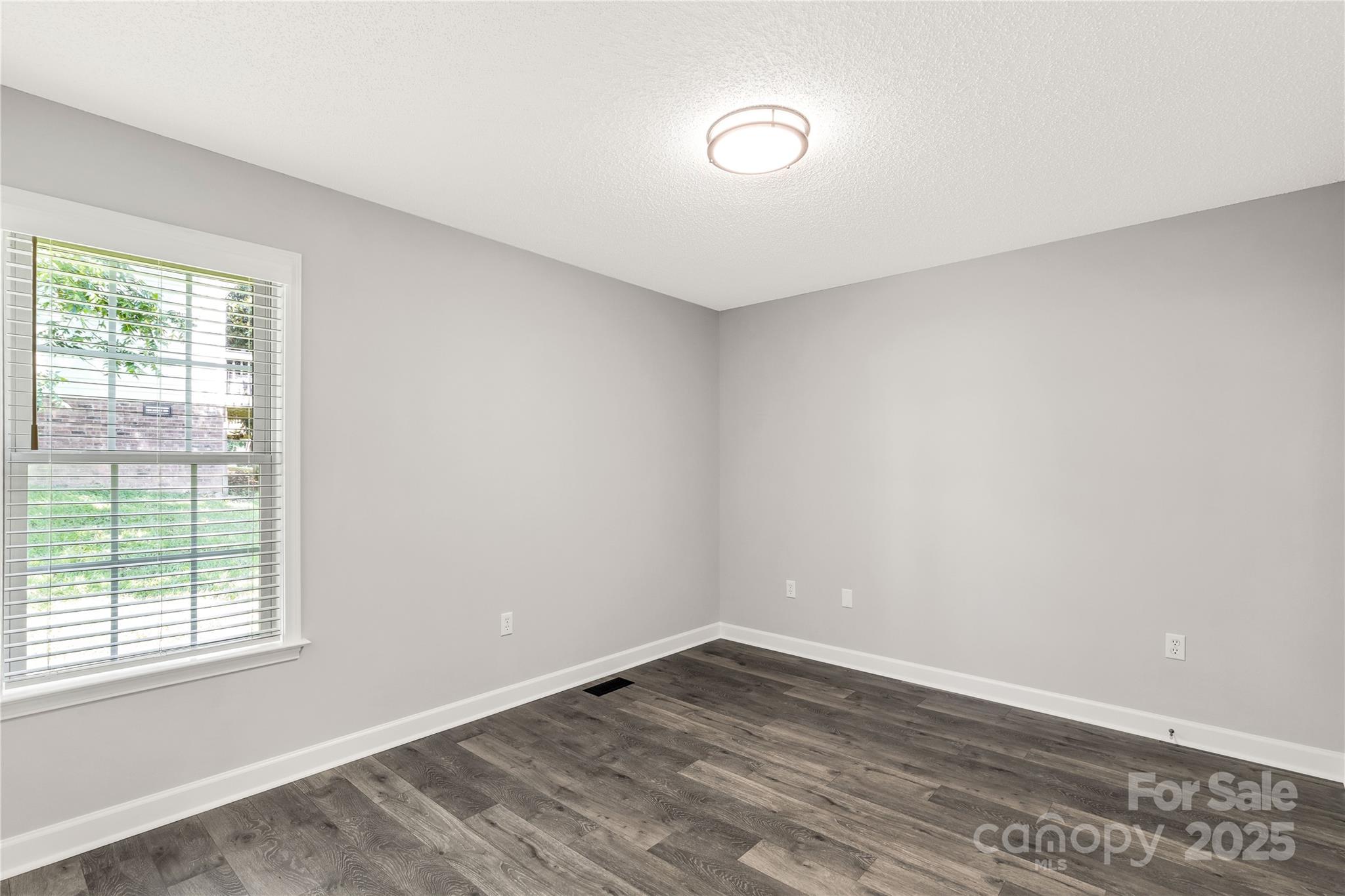 1675 Old Lynwood Circle Lancaster, SC 29720 - Photo 23 of 32 a view of an empty room with wooden floor and a window