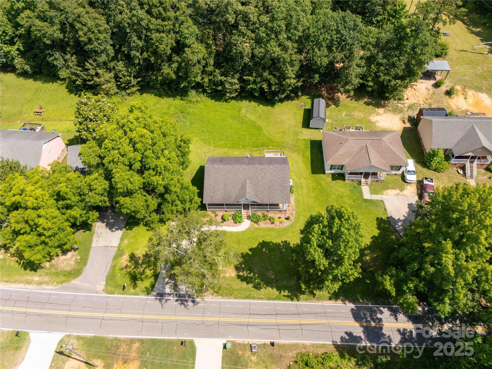 1675 Old Lynwood Circle Lancaster, SC 29720 - Photo 28 of 32 an aerial view of a house with a garden and swimming pool