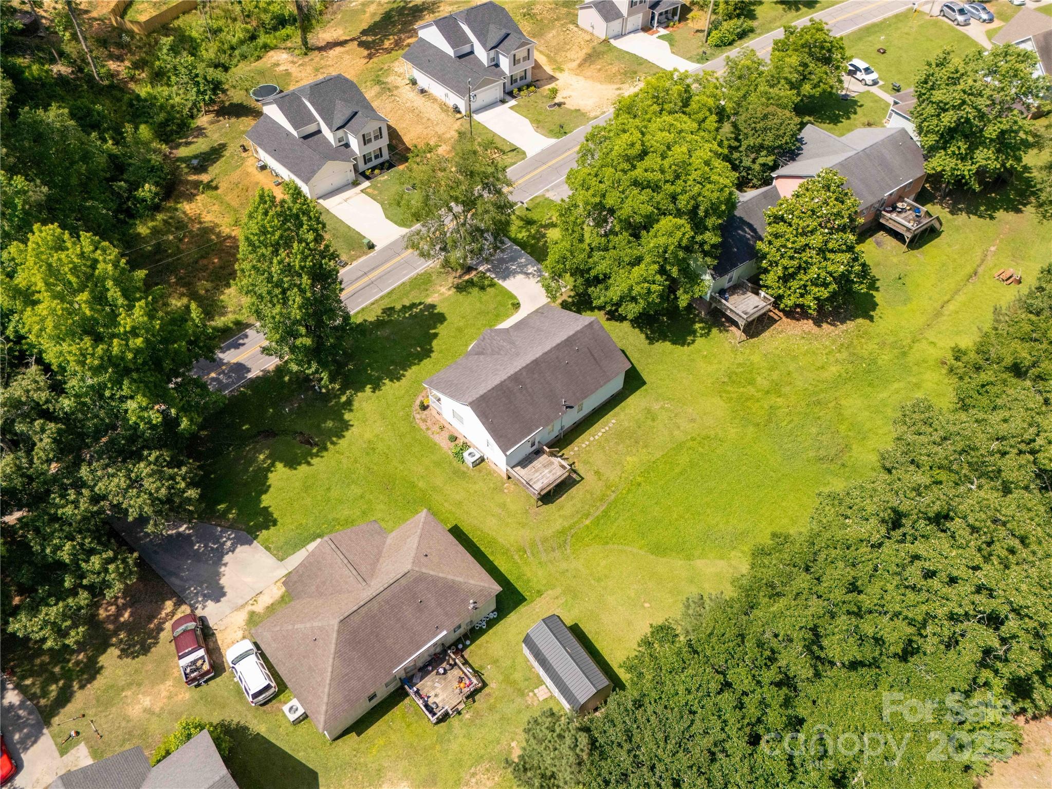 1675 Old Lynwood Circle Lancaster, SC 29720 - Photo 30 of 32 an aerial view of residential house with swimming pool and lawn chairs