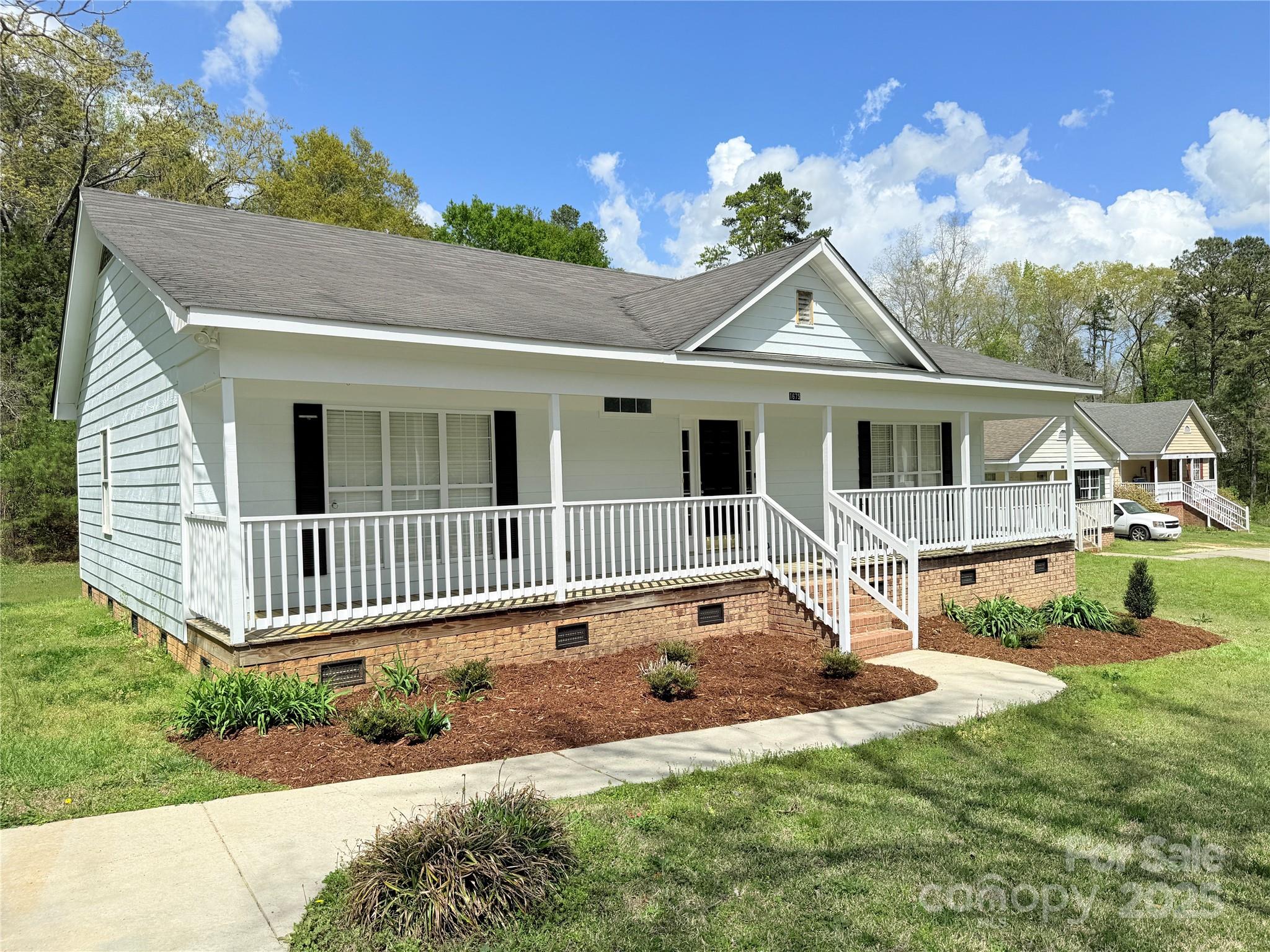 1675 Old Lynwood Circle Lancaster, SC 29720 - Photo 4 of 32 a front view of a house with a yard