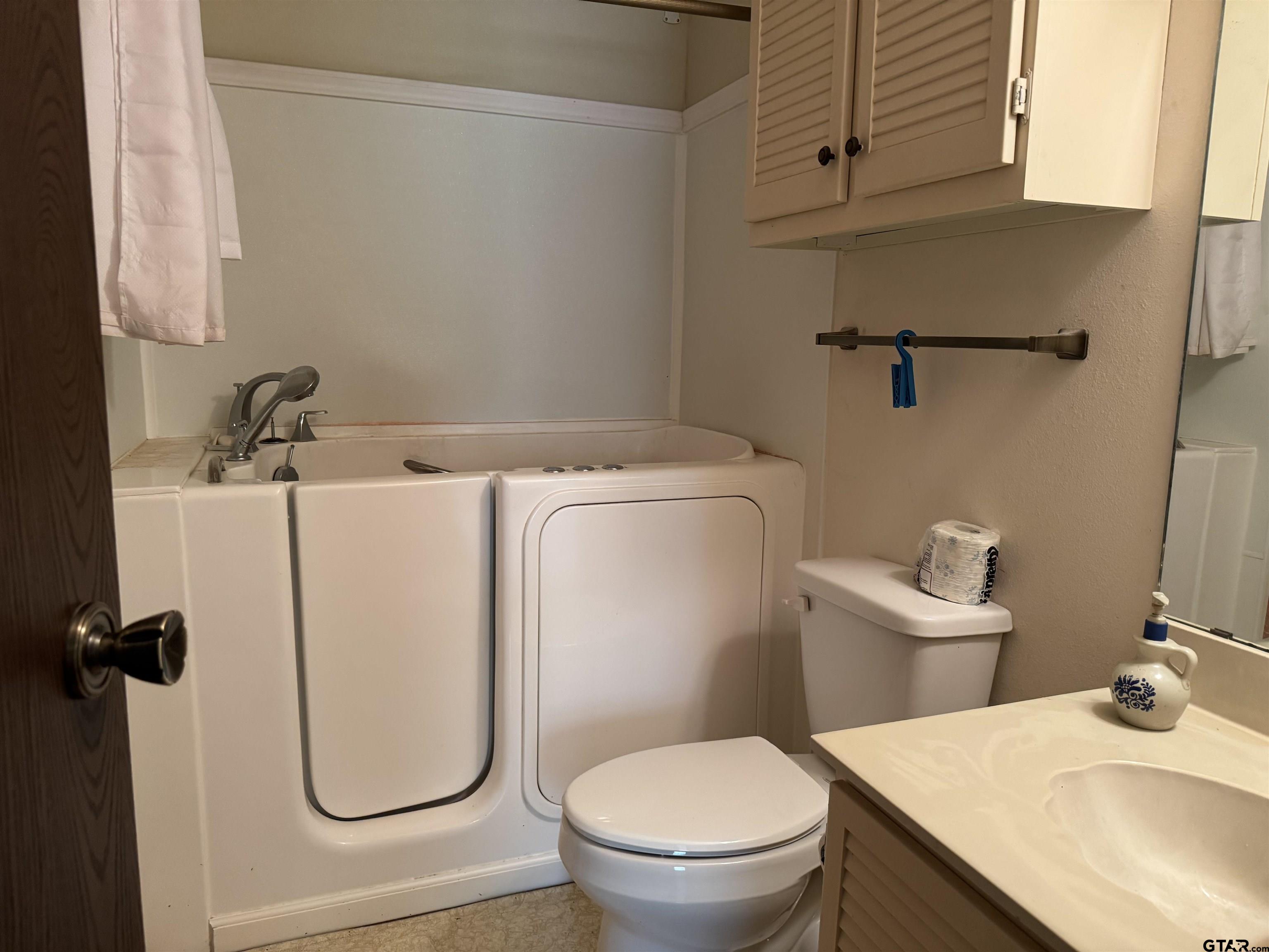 289 Llano Bend Holly Lake Ranch, TX 75765 - Photo 14 of 48 a bathroom with a sink toilet and vanity