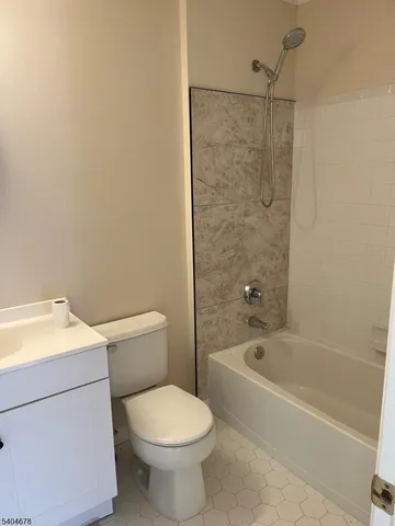 a bathroom with a toilet and a bathtub
