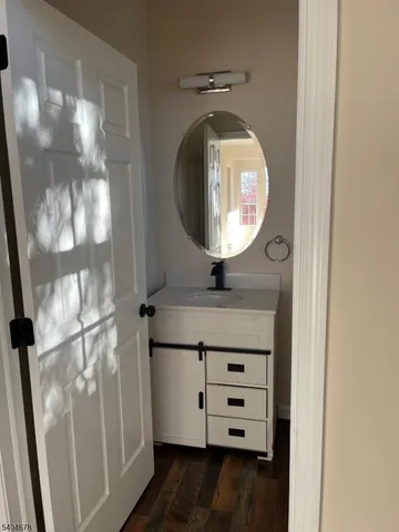 a bathroom with a mirror and a sink