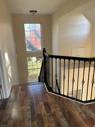 a view of entryway with wooden floor