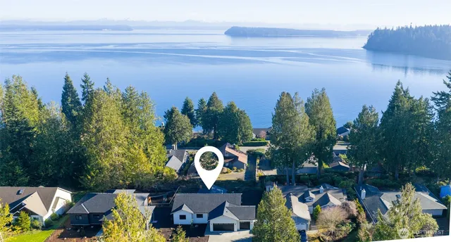 a view of a balcony with chairs and a table