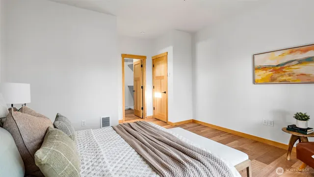 a bedroom with a bed and a chair