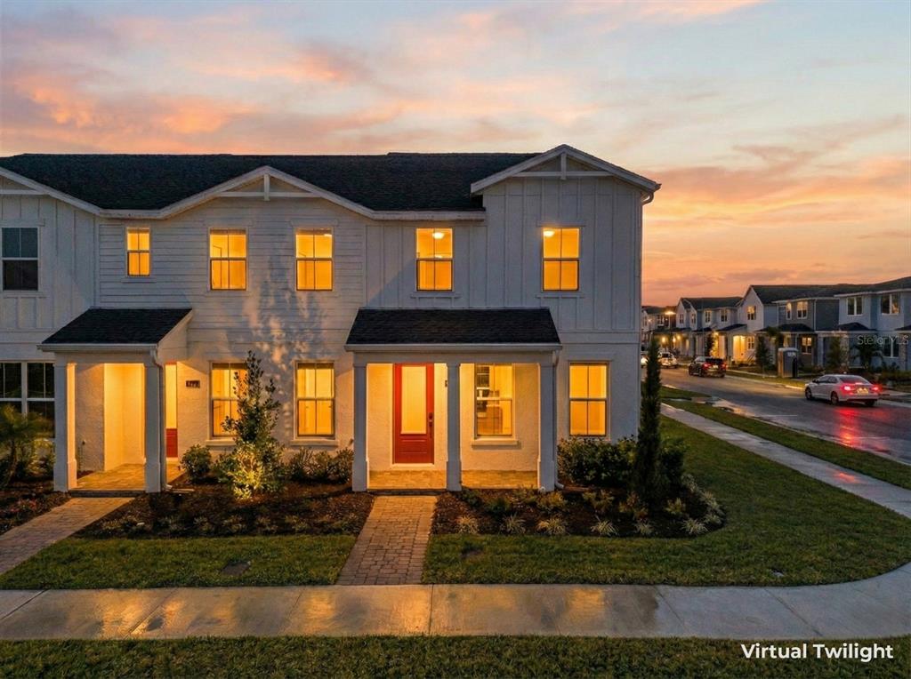 1850 Falconhurst Lane Apopka, FL 32703 - Photo 2 of 73 a front view of a house with a yard