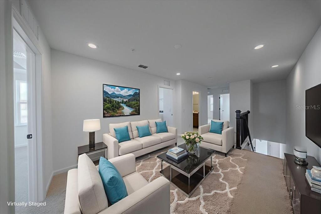 1850 Falconhurst Lane Apopka, FL 32703 - Photo 32 of 73 a living room with furniture a flat screen tv and a window