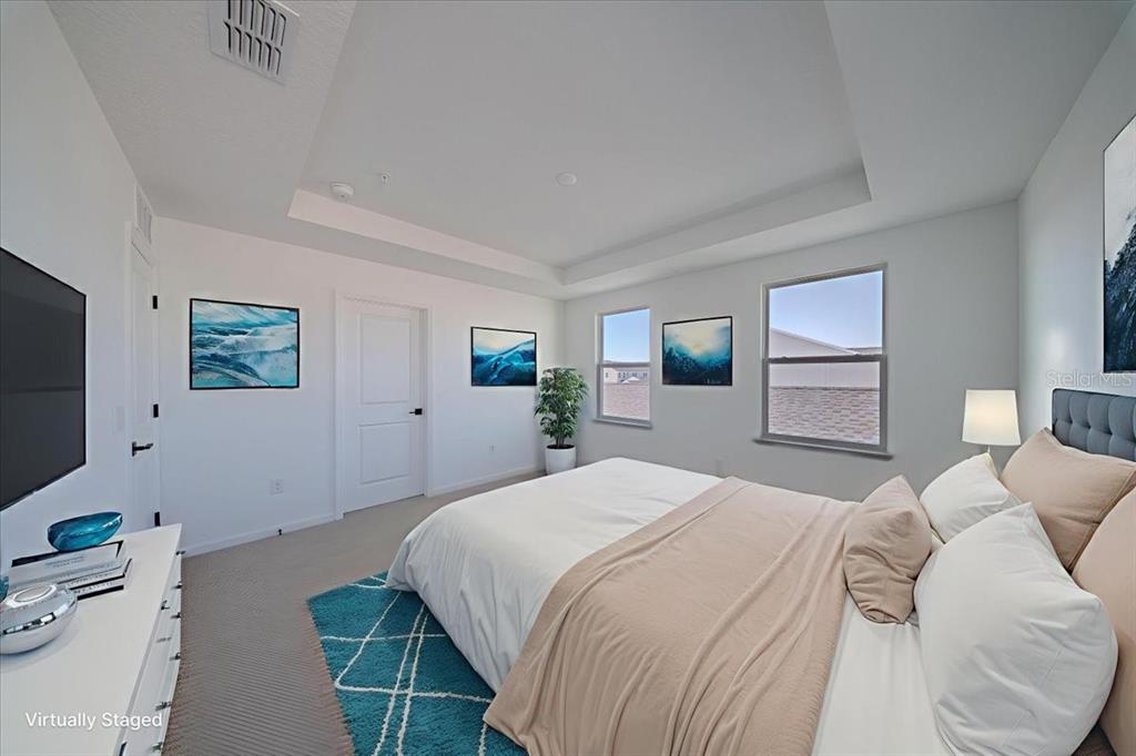 1850 Falconhurst Lane Apopka, FL 32703 - Photo 37 of 73 a bedroom with a bed and a flat screen tv